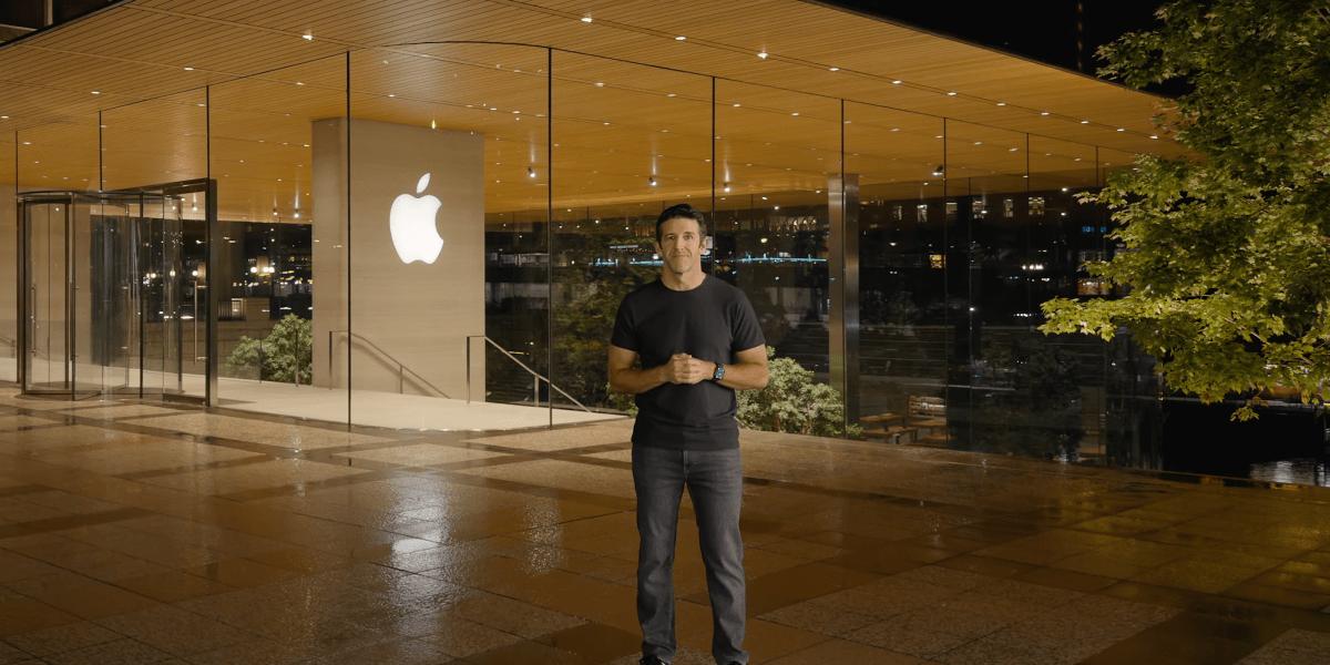 Apple Store glass building exterior at night with logo